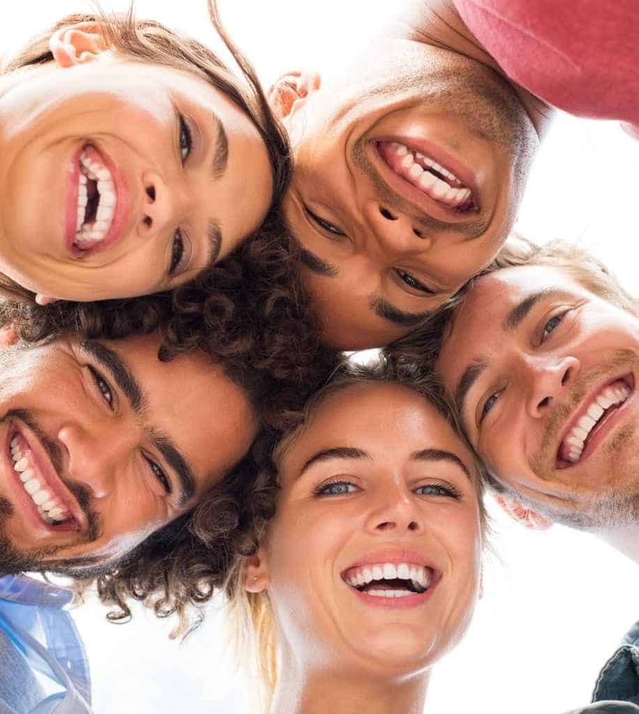Smiling person showcasing white teeth after laser whitening treatment Corby